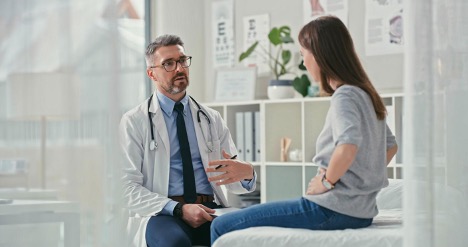 Woman speaking with a doctor about managing IBS symptoms