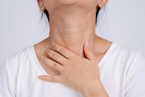 woman-with-esophagitis-holding-her-neck-gastrointestinal-bleeding-concept